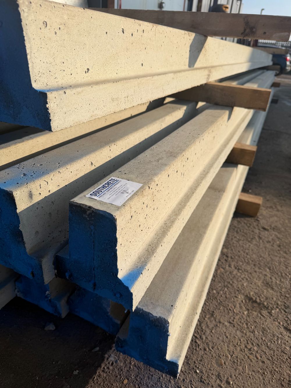 Stack of prestressed concrete beams bearing the Southcrete label